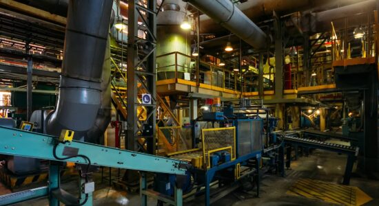 Industrial plants from the inside, pipelines, conveyor belts, machines, in subdued light